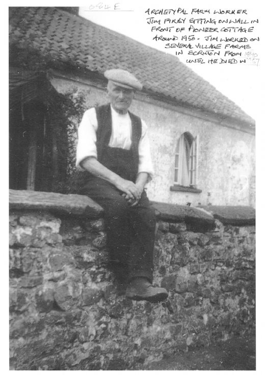 Jim Firby sitting on a wall in front of Pioneer Cottage in 1950